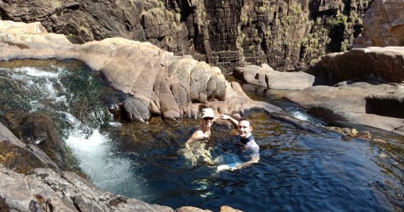 couple relaxing in natural pool in the Top End of Australia